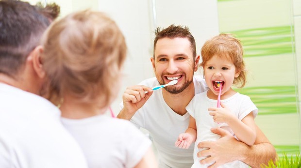 How do parents teach children to brush their teeth?