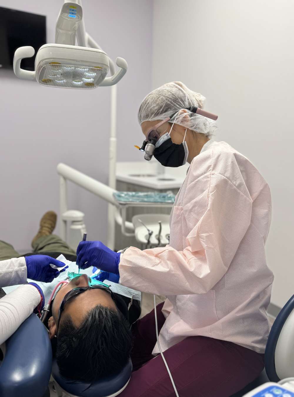 Top Dental dentist caring for a patient